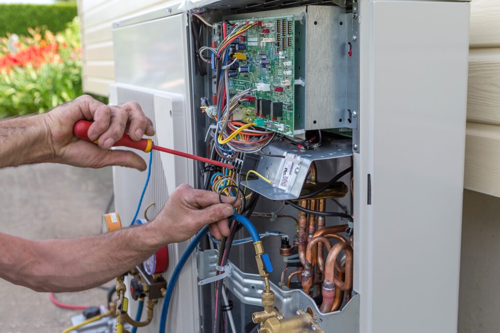plumber at work installing a circulation pump